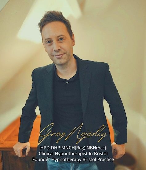 Greg Nejedly profile pic Profile pic of Greg Nejedly leaning against a desk, smartly dressed.